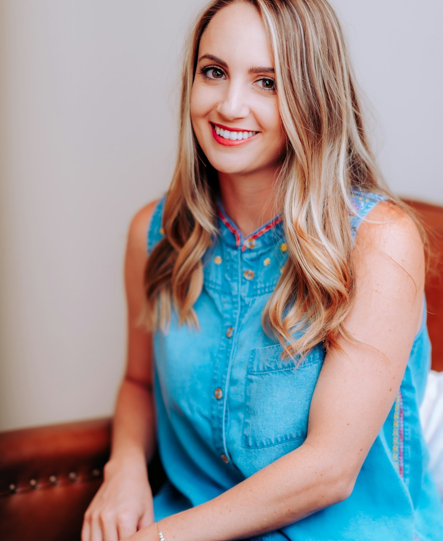 Smiling woman in her forties in a calm indoor setting